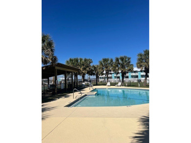 Charming condo featuring fabulous water views on one side and a