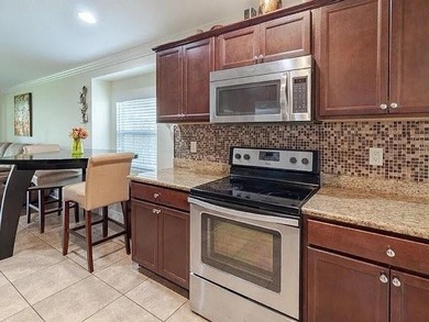 Step inside to a bright, 4BR 2 BA home enhanced by warm wood - photo 2