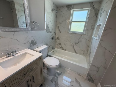Beautifully renovated 4-bedroom, 2-bath home in Bay Shore - photo 13