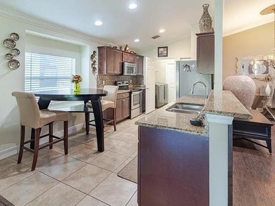 Step inside to a bright, 4BR 2 BA home enhanced by warm wood - photo 3