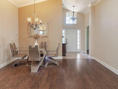 Step inside to a bright, 4BR 2 BA home enhanced by warm wood - photo 4