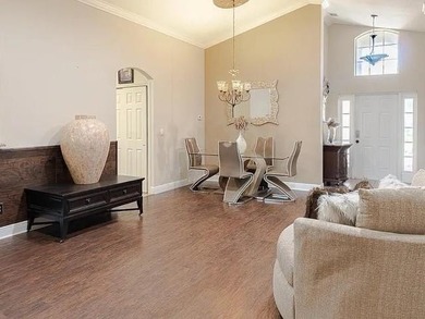Step inside to a bright, 4BR 2 BA home enhanced by warm wood - photo 5