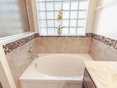 Step inside to a bright, 4BR 2 BA home enhanced by warm wood - photo 10