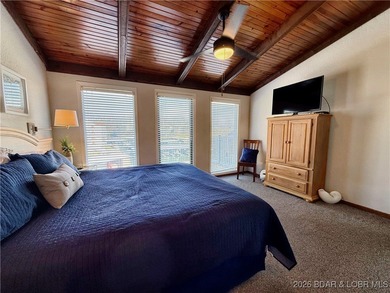 Enjoy lake living at its best in this beautifully maintained