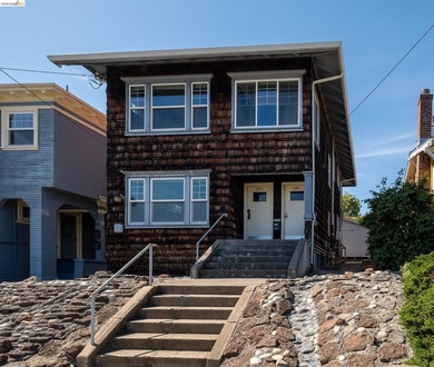 This beautifully preserved 1910 duplex blends timeless character - photo 1