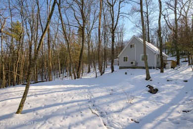 Welcome to this charming chalet style home offering 2 bedrooms