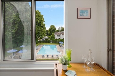 Overlooking the lush greenery and in-ground pool, this private - photo 21