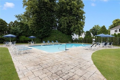 Overlooking the lush greenery and in-ground pool, this private - photo 24