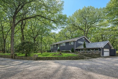Set on 1.92 acres in North Haven, this property offers two - photo 2