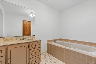 Set on a quiet, tree-lined cul-de-sac in Wading River and - photo 18