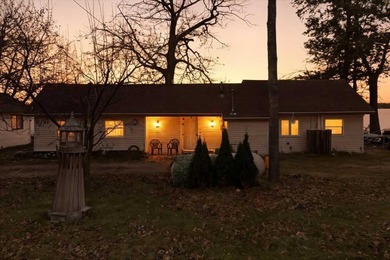 Lake Home For Sale in Carp Lake, Michigan