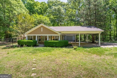Set along the coveted shoreline of Lake Oconee, this exceptional - photo 1