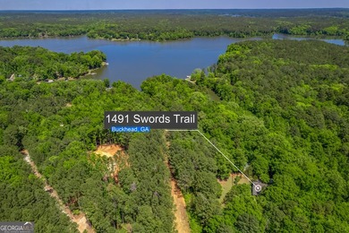 Set along the coveted shoreline of Lake Oconee, this exceptional - photo 2