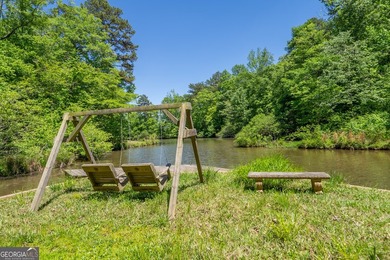 Set along the coveted shoreline of Lake Oconee, this exceptional - photo 3