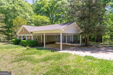 Set along the coveted shoreline of Lake Oconee, this exceptional - photo 4