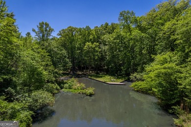 Set along the coveted shoreline of Lake Oconee, this exceptional - photo 7