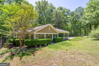 Set along the coveted shoreline of Lake Oconee, this exceptional - photo 9