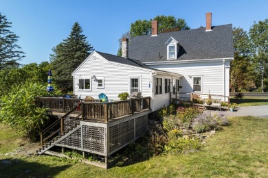 Welcome to this beautifully updated New England-style home with