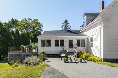Welcome to this beautifully updated New England-style home with