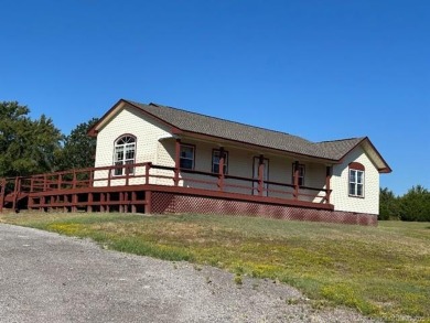 This home is placed in the center of a fenced and gated 5-acre
