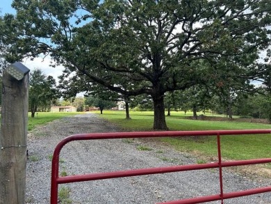 This home is placed in the center of a fenced and gated 5-acre