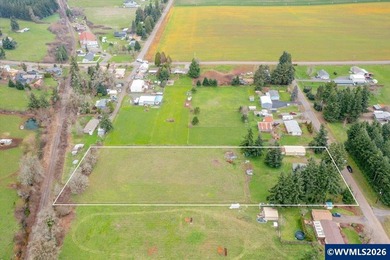 Mostly flat 2.7-acre property in desirable Shaw area within