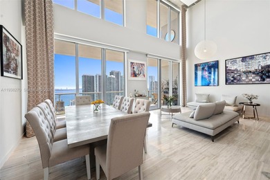Penthouse 207 is a two-story residence offering expansive