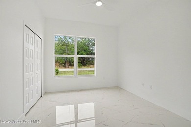 This beautifully designed 4 bed 2 bath concrete block home - photo 12