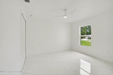This beautifully designed 4 bed 2 bath concrete block home - photo 13