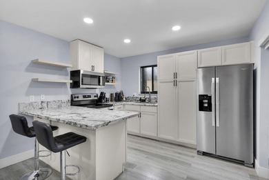 Welcome to this beautifully remodeled 2 bedroom, 1.5 bathroom - photo 1