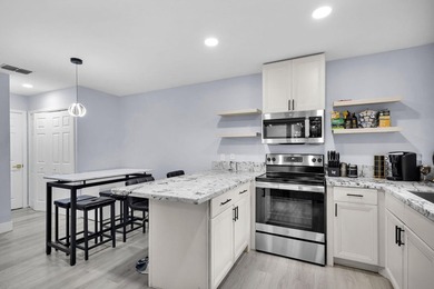 Welcome to this beautifully remodeled 2 bedroom, 1.5 bathroom - photo 4