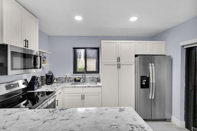 Welcome to this beautifully remodeled 2 bedroom, 1.5 bathroom - photo 6