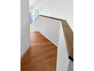 A rare corner unit with no shared walls, offering privacy and - photo 12