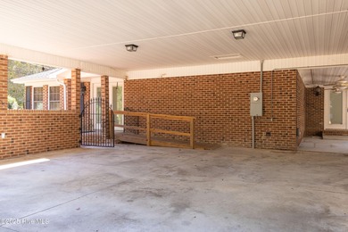 This charming brick ranch stands out on its corner lot within