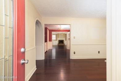 This charming brick ranch stands out on its corner lot within