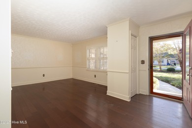 This charming brick ranch stands out on its corner lot within