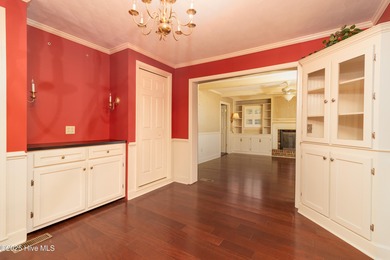 This charming brick ranch stands out on its corner lot within