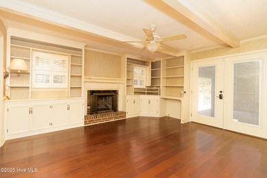 This charming brick ranch stands out on its corner lot within