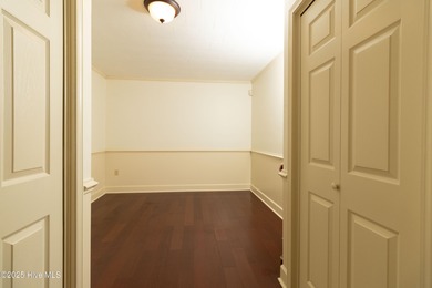 This charming brick ranch stands out on its corner lot within