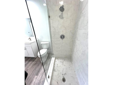 Stunning all-white, tastefully remodeled Penthouse featuring