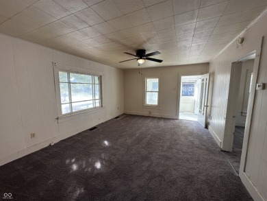 2 bedroom home with solid bones! This home includes mature trees