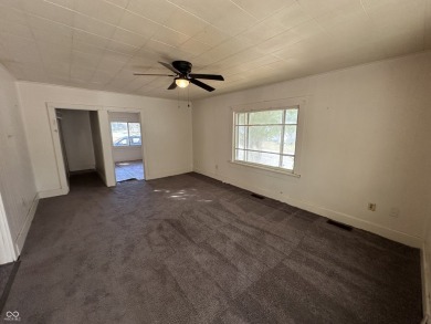 2 bedroom home with solid bones! This home includes mature trees