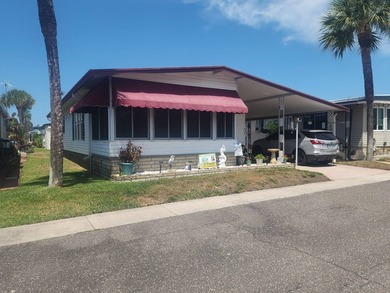 Welcome to this charming manufactured double-wide in the very - photo 1