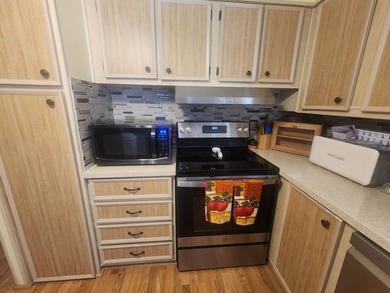 Welcome to this charming manufactured double-wide in the very - photo 5
