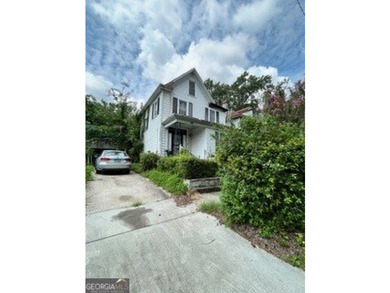 1221 E 31st Street presents an opportunity for renovation or new - photo 1