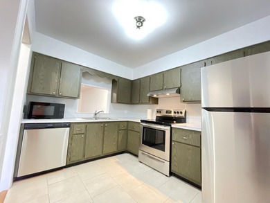Beautifully updated 2-bedroom, 1-bath second-floor condo in the - photo 1