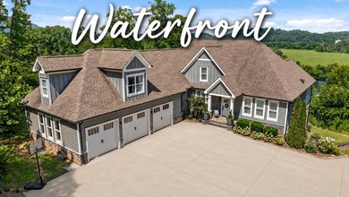 Experience exceptional waterfront living in this custom-built - photo 1