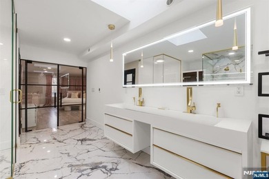 Welcome to this striking, fully-renovated modern masterpiece set - photo 12
