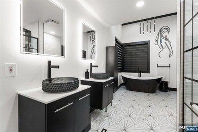 Welcome to this striking, fully-renovated modern masterpiece set - photo 16