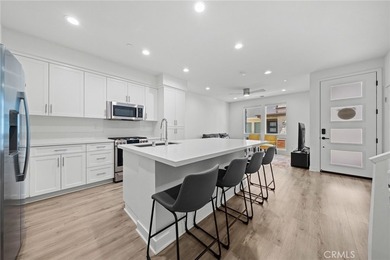 Built in 2021, this highly desirable two-story townhome offers 3 - photo 1